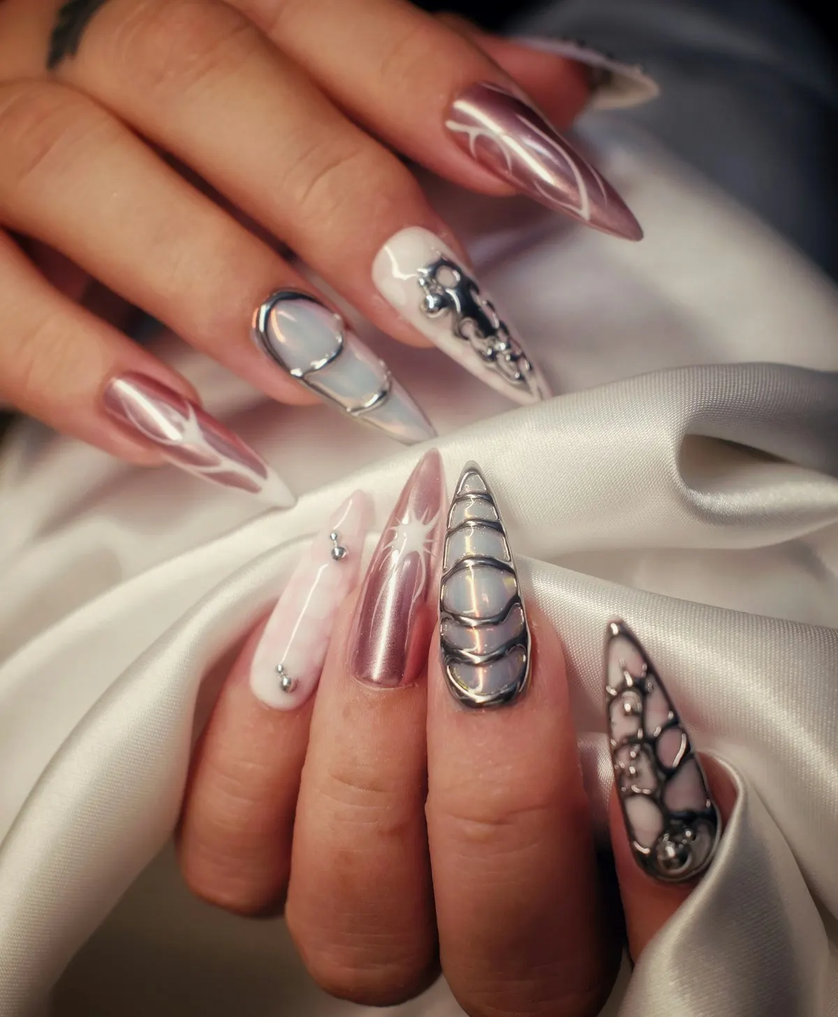Stiletto nails with chrome and jewelled art